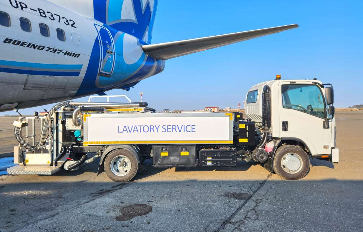 Lavatory service truck connected to a Boeing 737-800 aircraft