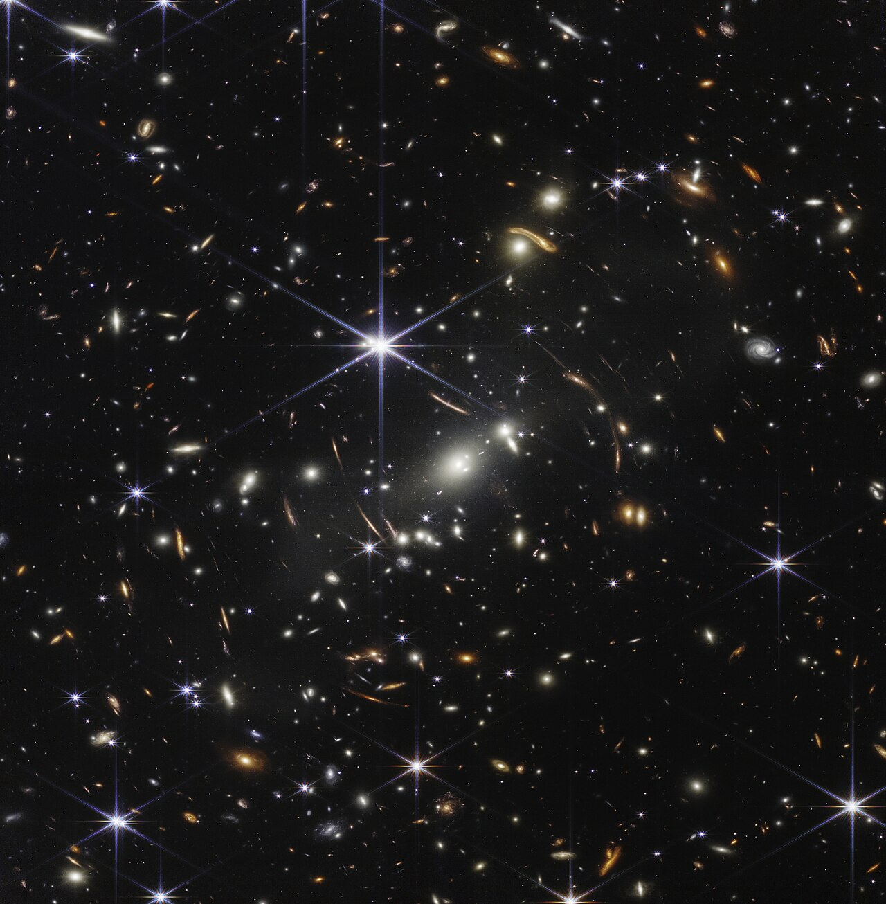 James Webb Space Telescope deep field image showing thousands of distant galaxies and stars against the darkness of space.